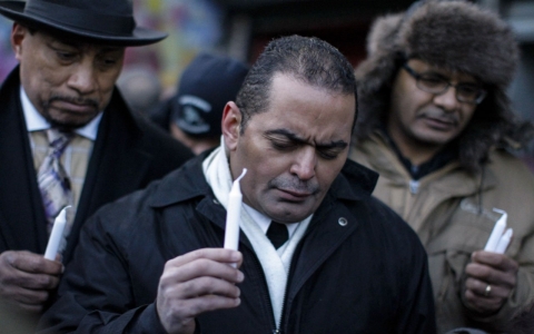 Members of the Friendly Hands Ministry church take part in a Vigil next to a site of an explosion in East Harlem on March 13, 2014 in New York City. 